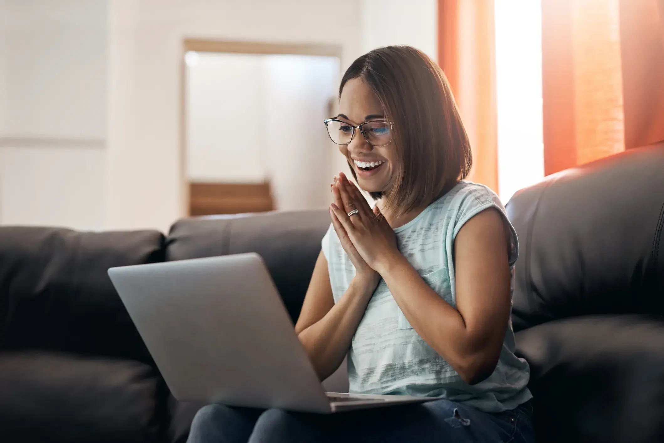 Thankful woman with laptop