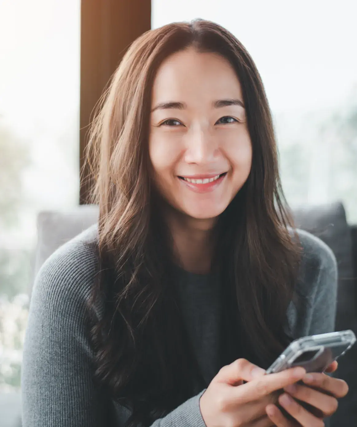 Woman working from her phone