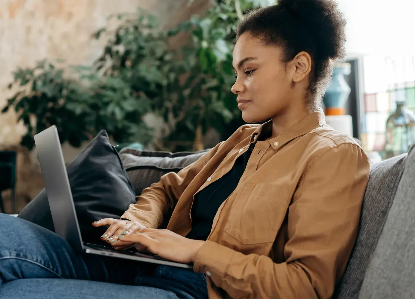 Woman working from couch